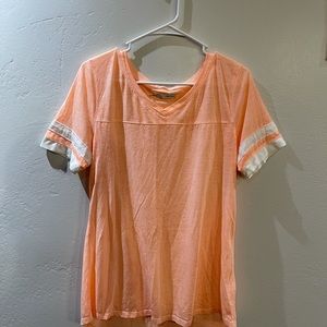 Light Orange with White stripes on sleeve.